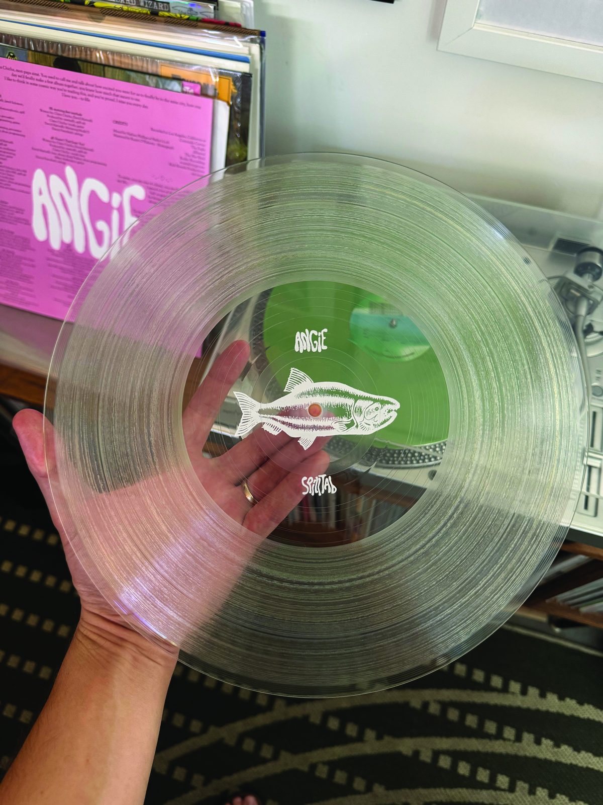 Clear record with a fish printed in the center